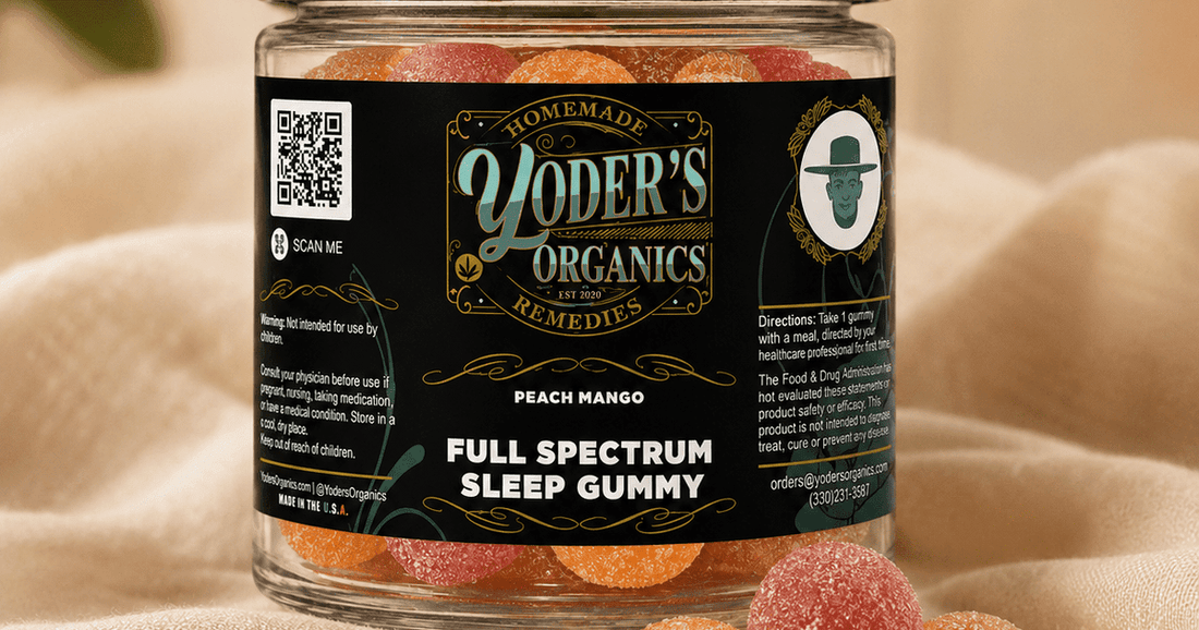 Jar of Yoder's Organics Full Spectrum Sleep Gummies in peach mango, with loose gummies on soft linen