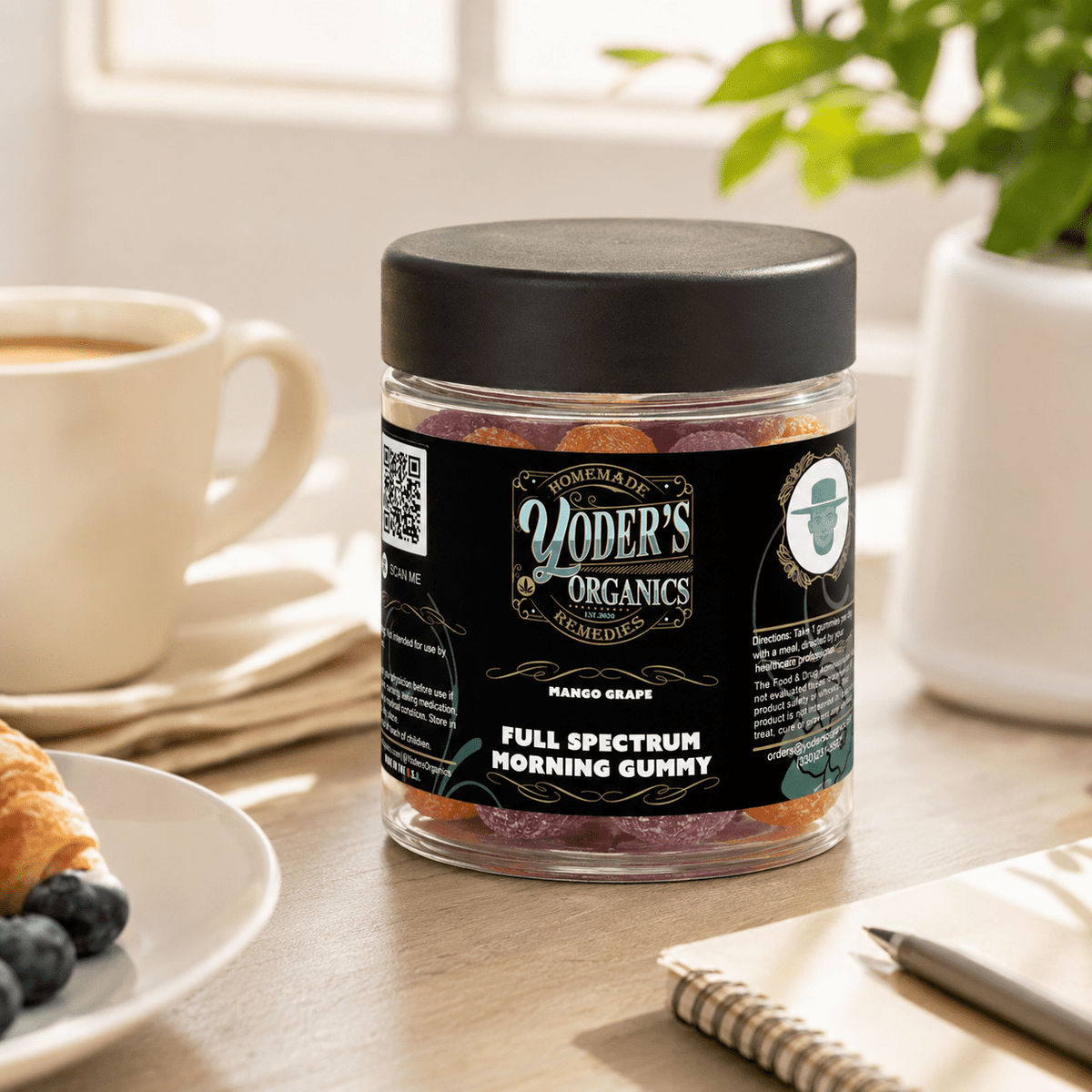 Full spectrum CBG morning gummies on a breakfast table beside a cup of coffee